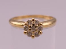 An 18 ct gold diamond ring. Ring size N/O. 3.8 grammes total weight.