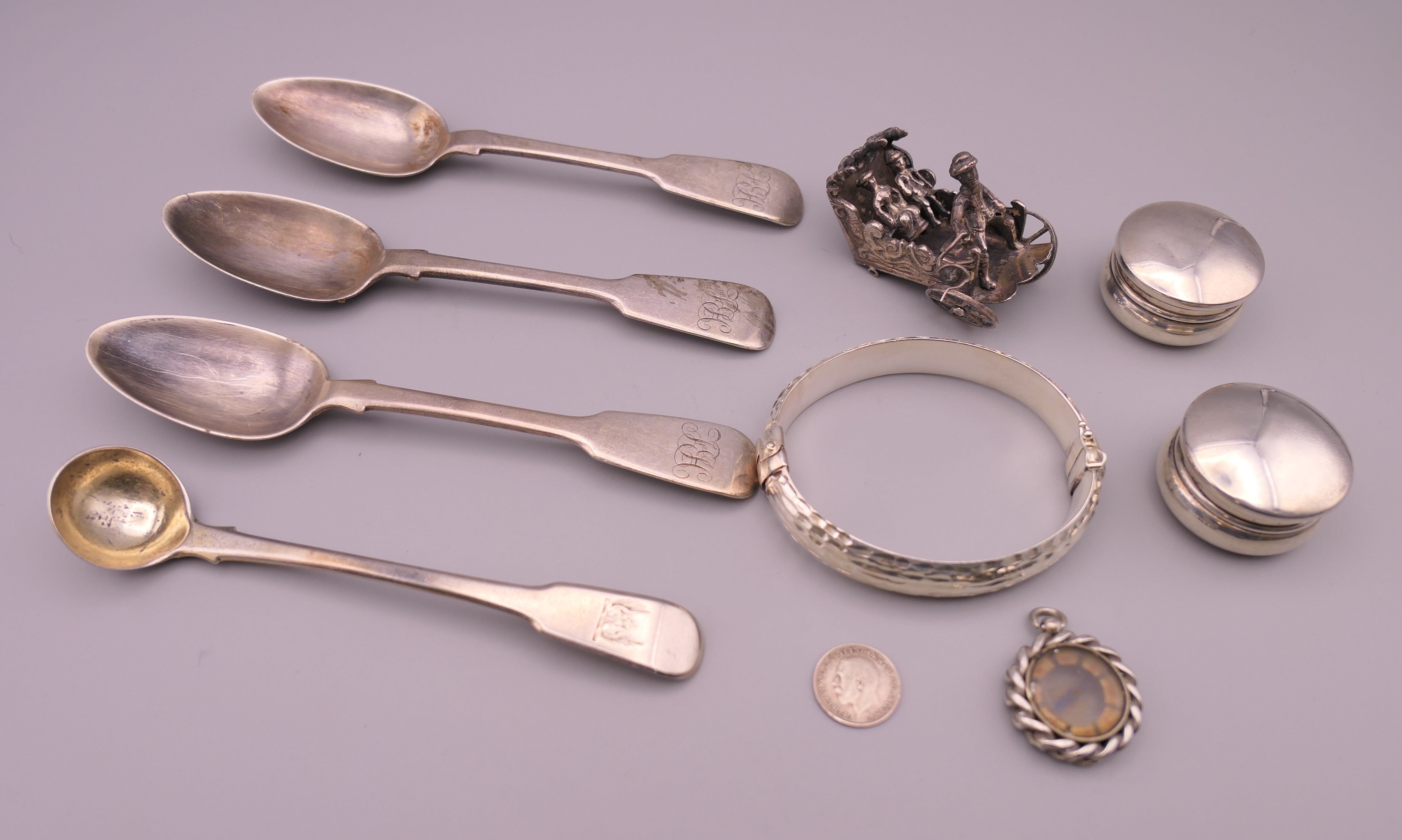 A quantity of small silver items, including a bracelet, spoons, pill boxes, etc. Three spoons 14.