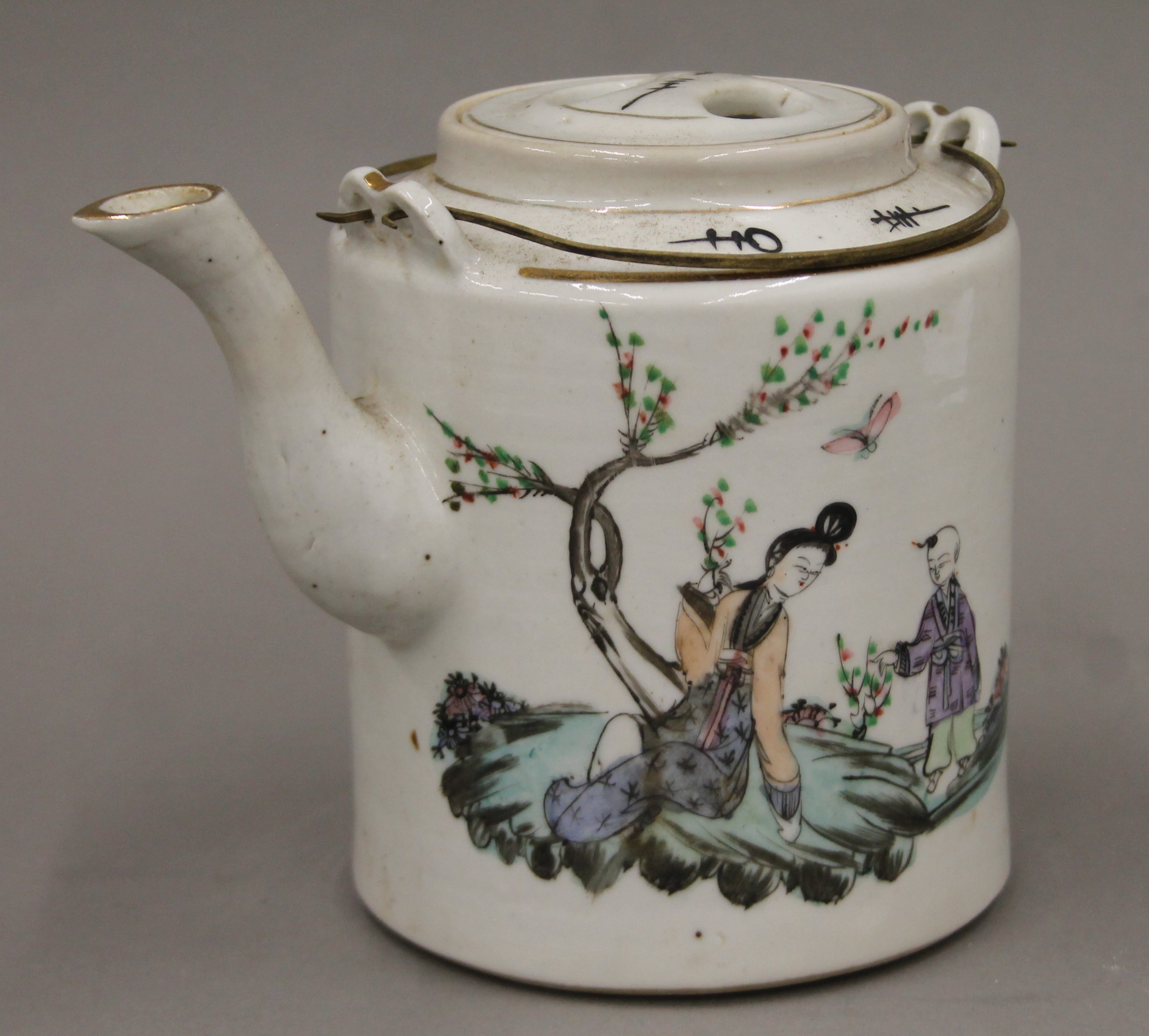 A late 19th/early 20th century Chinese teapot and two tea bowls, housed in a basket. - Image 2 of 11