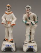 A pair of Continental pottery figures. The largest 14 cm high.