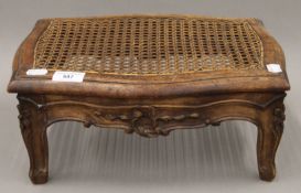 A Victorian caned carved foot stool. 36.5 cm wide.