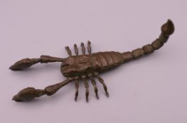 An articulated bronze model of a scorpion. 10.5 cm long.
