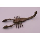 An articulated bronze model of a scorpion. 10.5 cm long.