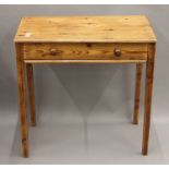 A 19th century pine single drawer table. 72.5 cm wide.