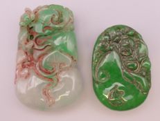 Two jade pendants. Largest 5.5 cm high.
