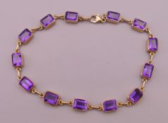 A 9 ct gold amethyst bracelet. 20 cm long. 8.3 grammes total weight.