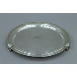 A silver salver. 25 cm diameter. 347.8 grammes.