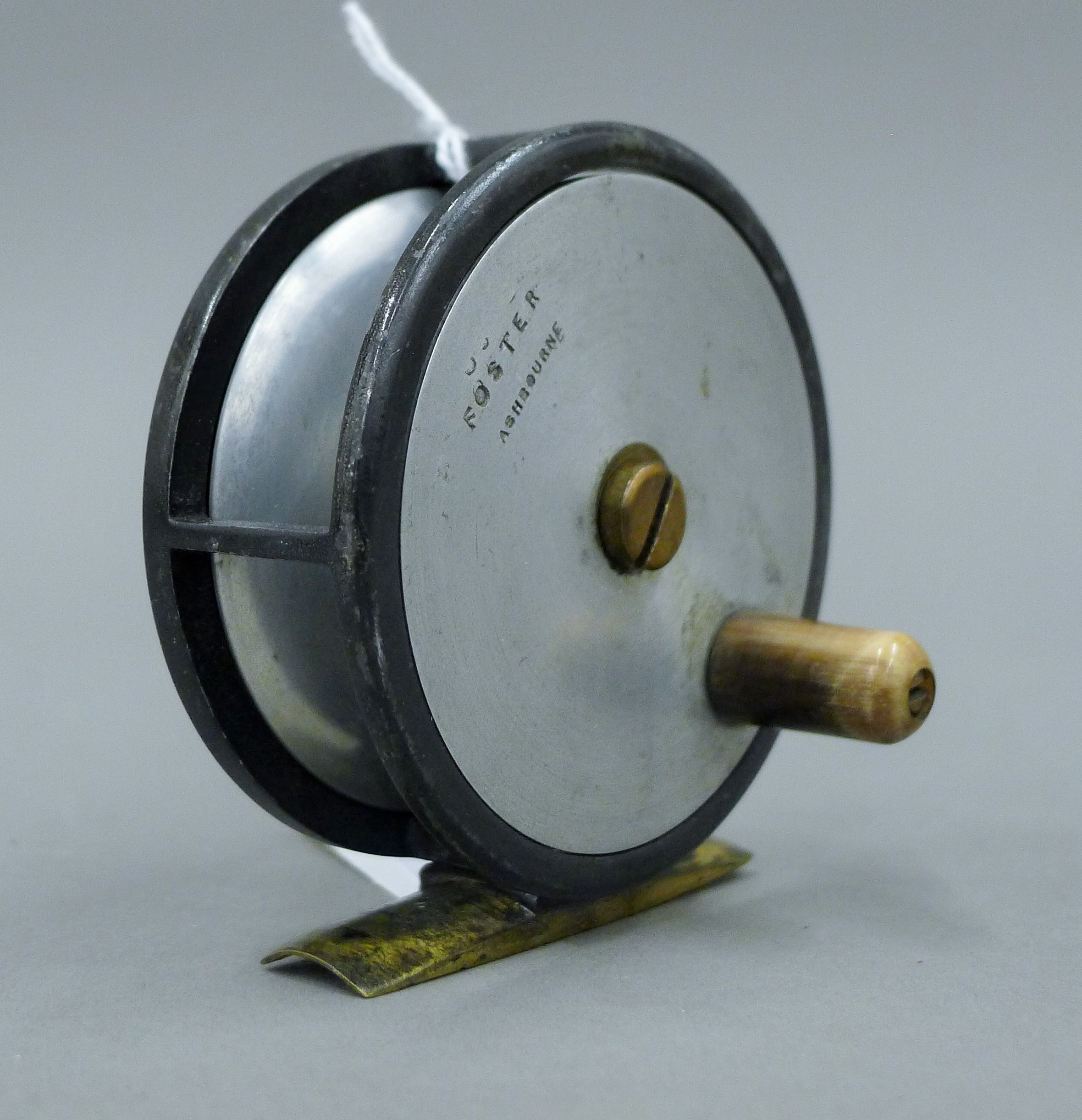 A 2 5/8'' diameter Foster of Ashbourne trout fly reel, alloy with brass foot and horn handle. - Image 2 of 4