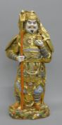 An early 20th century Japanese porcelain model of a Samurai. 32 cm high.