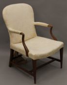 A 19th century upholstered open armchair. 65 cm wide.