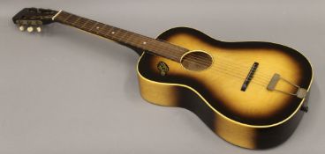 A vintage Martin Colletti steel strung guitar along with a vintage Hoffner pick-up and a soft case.