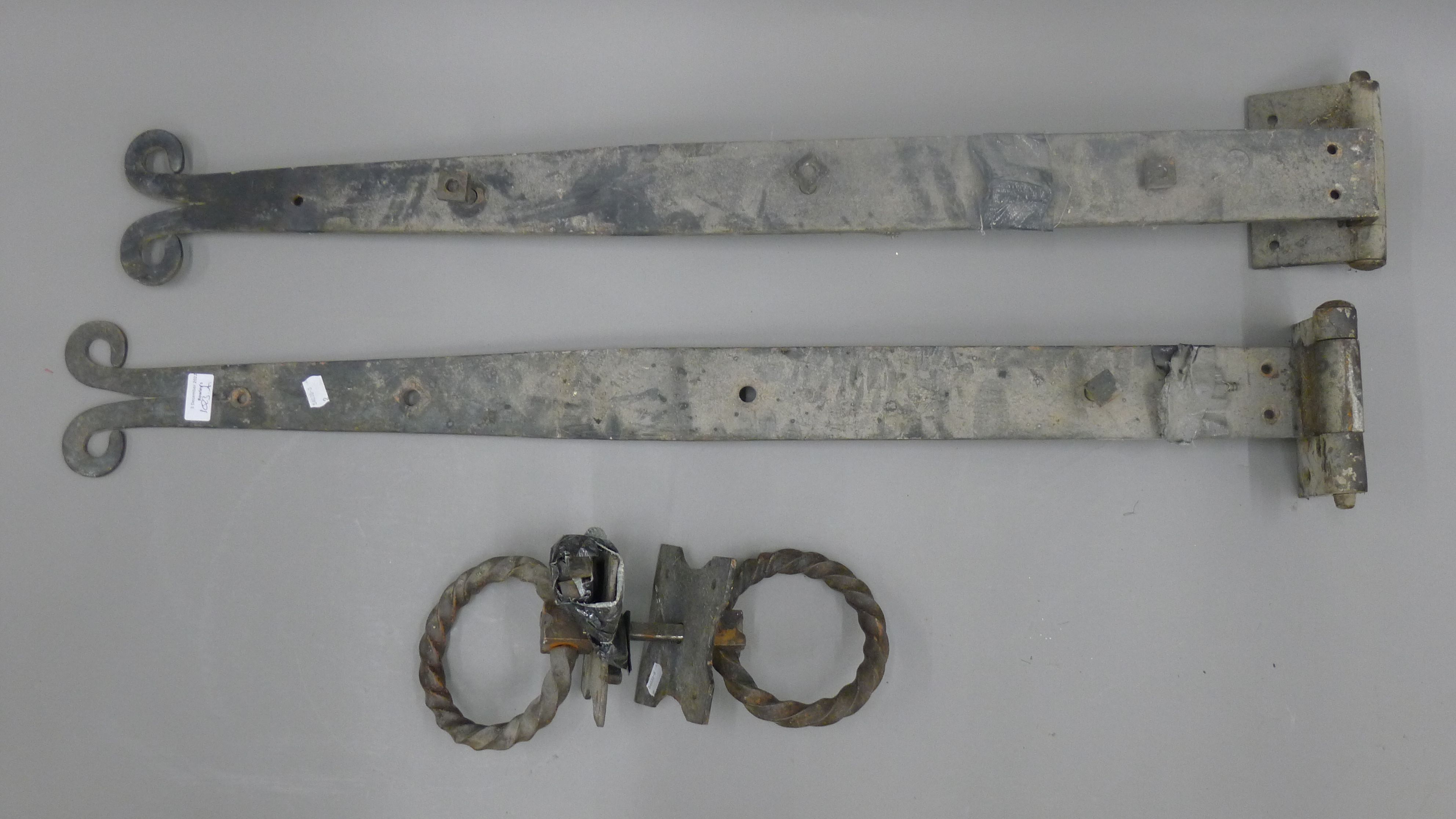A set of iron hinges and handles. Removed from St Mary's Church, Ely.