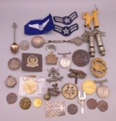 A quantity of various military medals, cap badges, coins, etc.