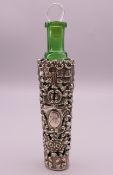 A green glass perfume bottle in silver case, hallmarked for Birmingham 1903. 15 cm high.