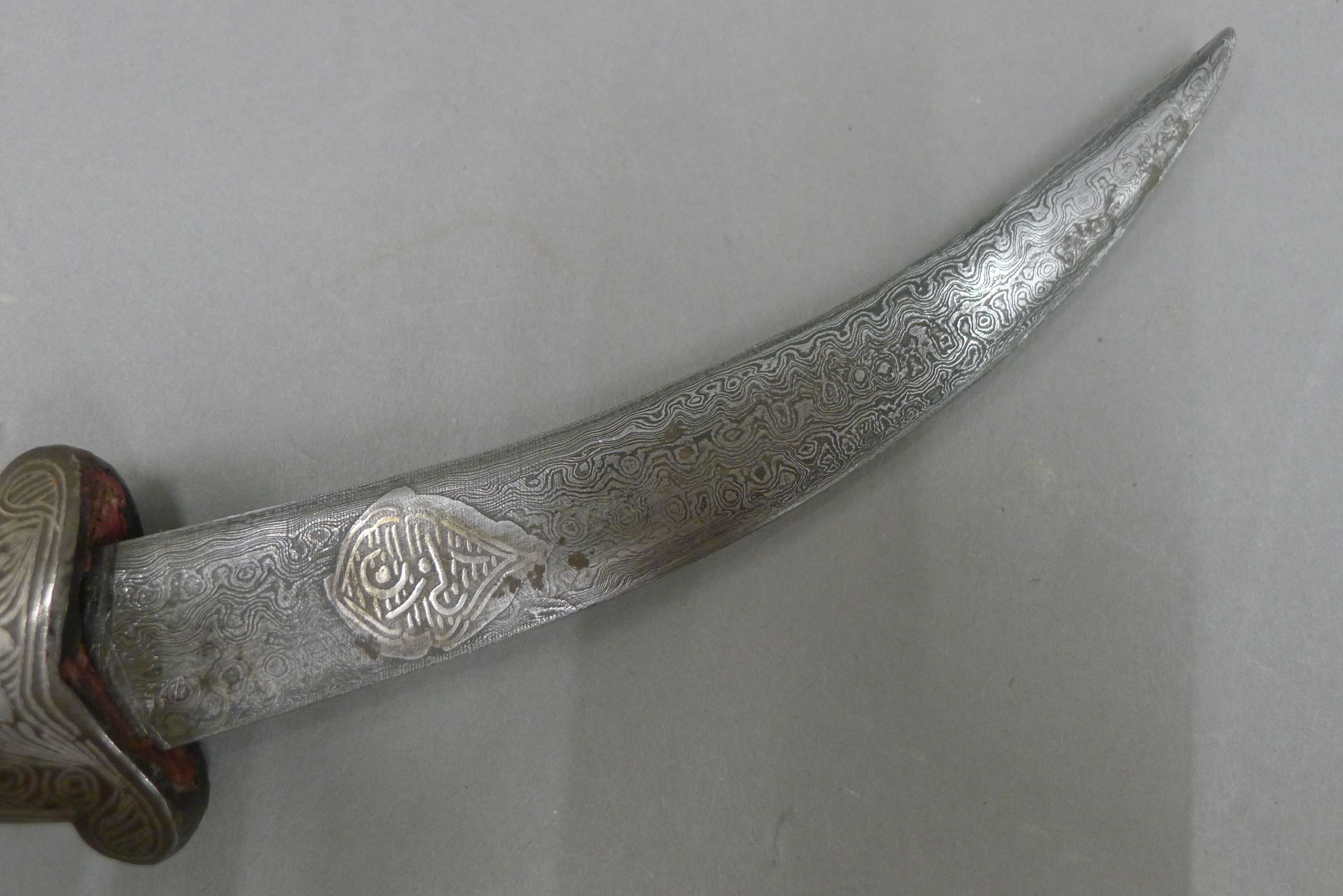 A 19th century Persian knife, the steel scabbard and grip inlaid with silver, - Image 4 of 6