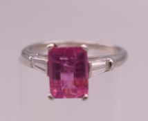 A platinum, diamond and pink tourmaline ring. Ring size L/M. 3.7 grammes total weight.