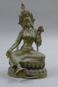 A large bronze model of a seated deity. 34.5 cm high.