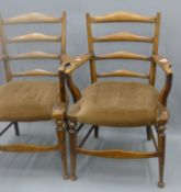 A pair of early 20th century upholstered ladder back chairs. 56.5 cm wide.