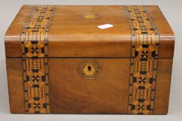 A Victorian inlaid walnut sewing box.