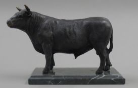 A bronze model of a bull. 17.5 cm high.