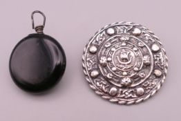 A Scottish silver brooch of Celtic design and a Ketcham & McDougall of New York watch holder brooch.