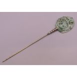 A 19th century Chinese apple green reticulated jade and silver hairpin formed as a dragon. 17.