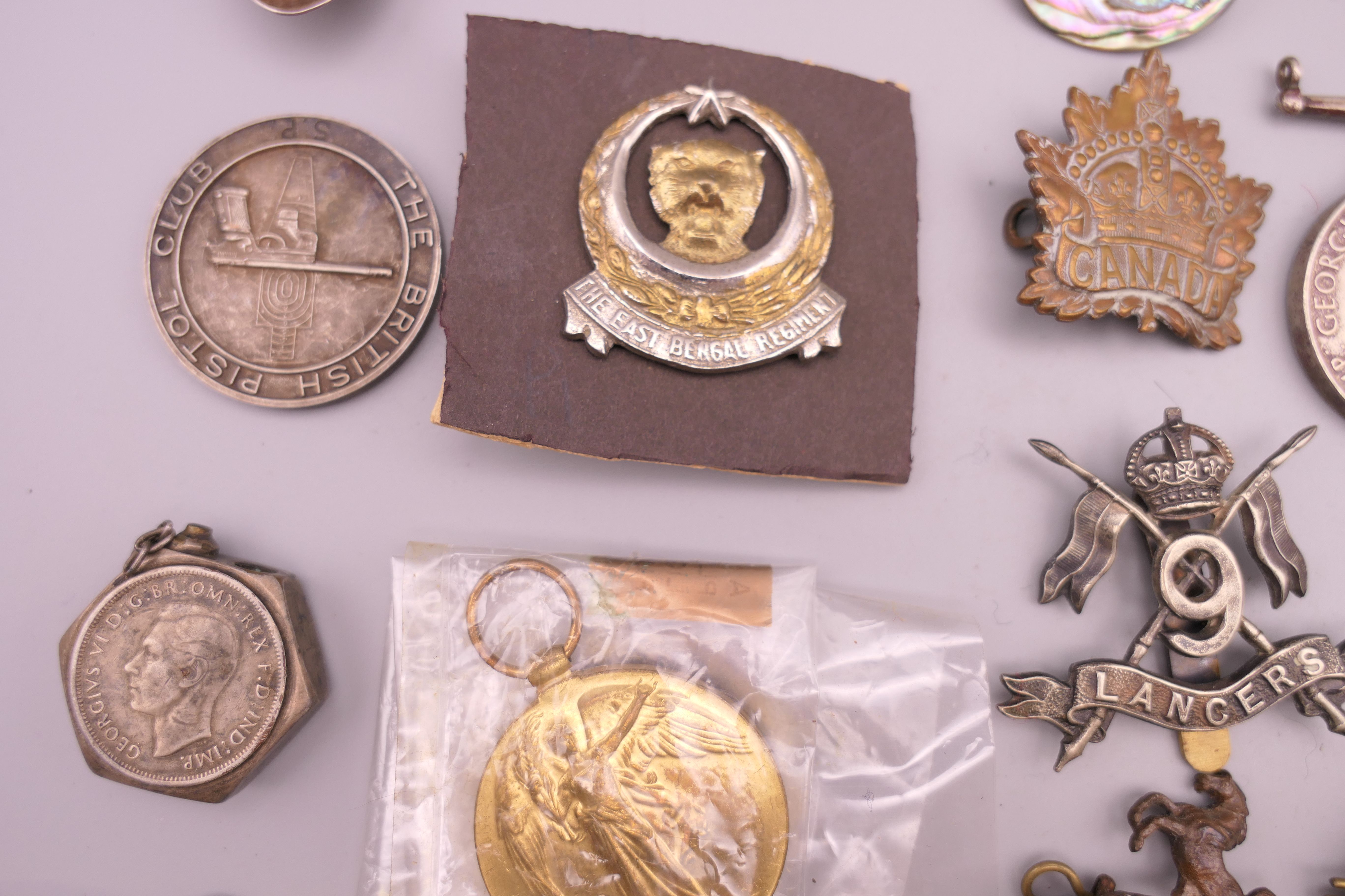 A quantity of various military medals, cap badges, coins, etc. - Image 7 of 9