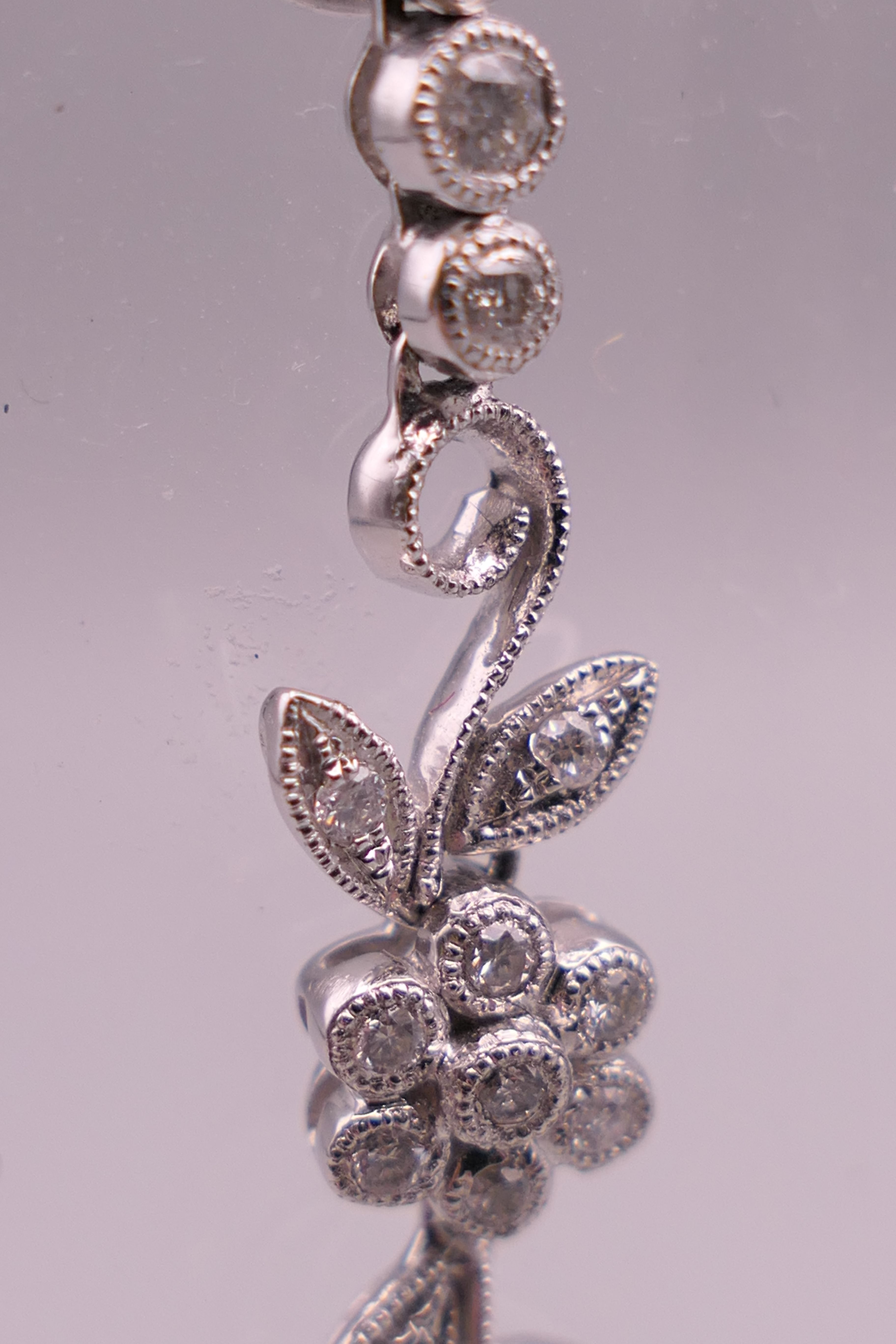 A pair of 18 ct white gold diamond flower drop earrings. Approximately 4 cm long. - Image 6 of 12