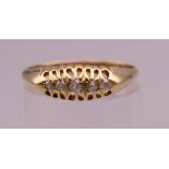 An 18 ct gold ring. Ring size P/Q. 2.2 grammes total weight.