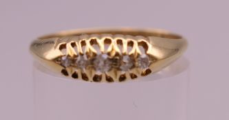 An 18 ct gold ring. Ring size P/Q. 2.2 grammes total weight.