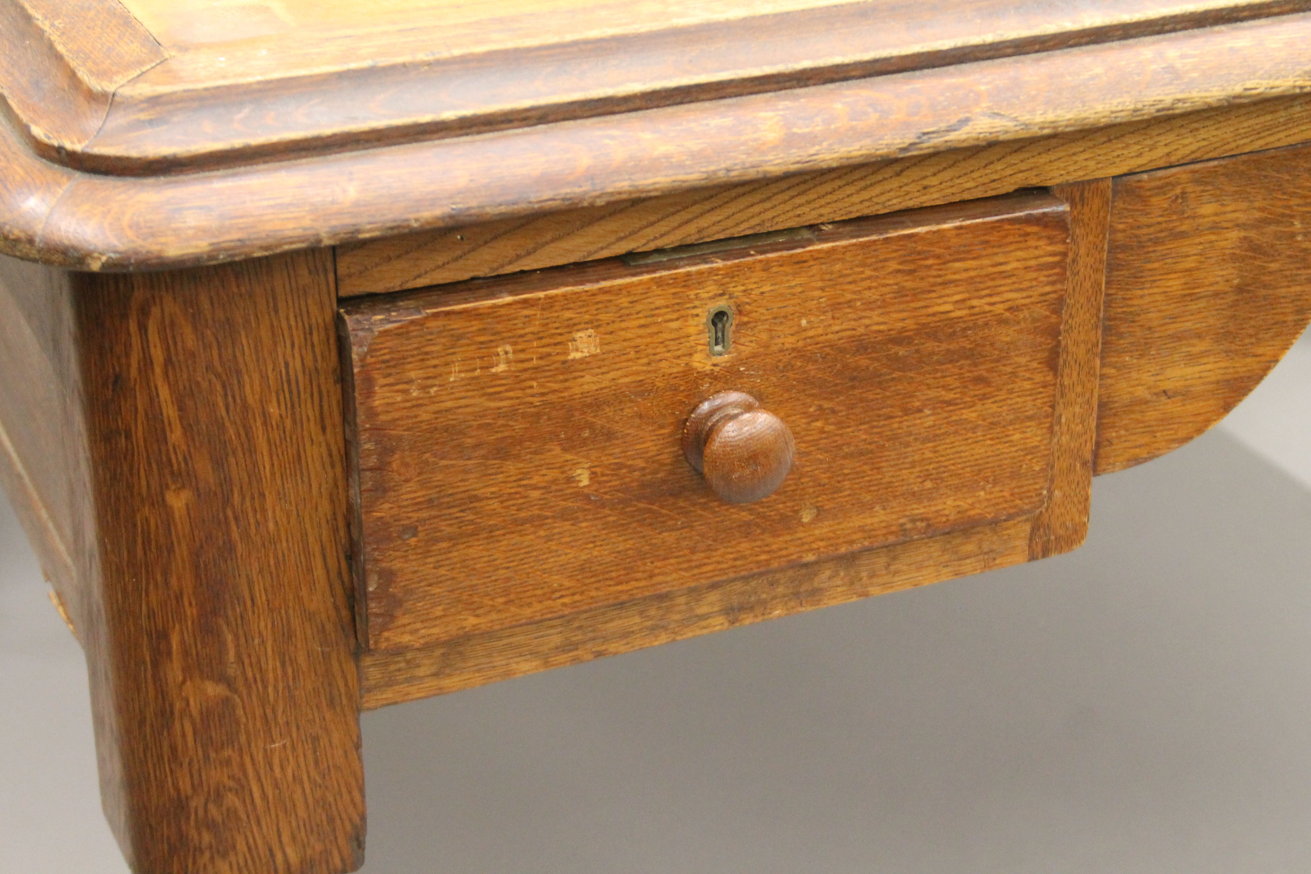 A Victorian oak partner's writing table. 153 cm wide. - Image 3 of 5