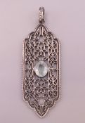 A silver, aquamarine and diamond pendant. 5.5 cm high excluding suspension loop.