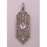 A silver, aquamarine and diamond pendant. 5.5 cm high excluding suspension loop.