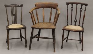 An elm seated smoker's bow armchair and two other chairs. The former 54 cm wide.