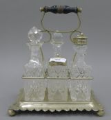 A silver plated cruet stand. 22 cm wide.