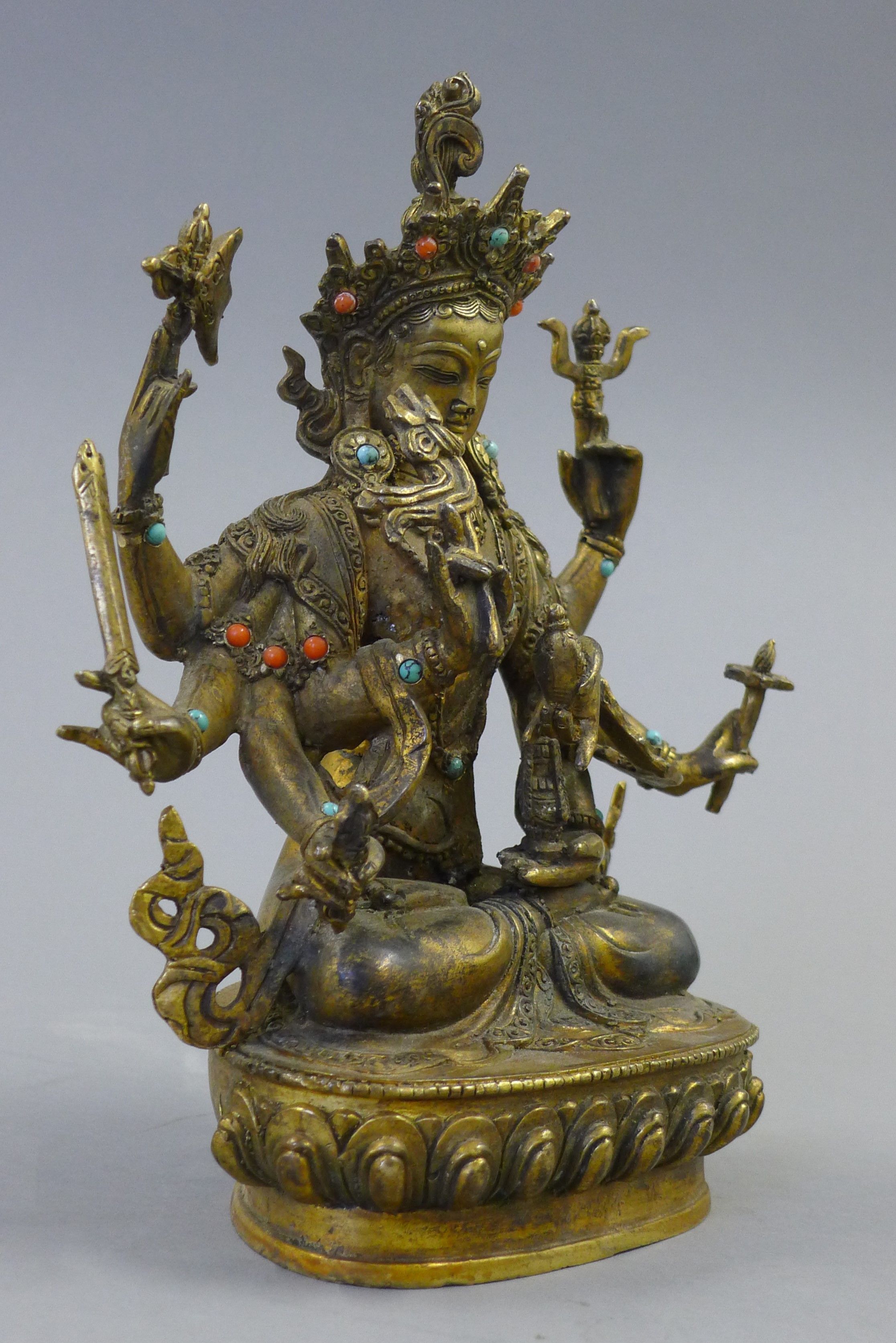 A gilt bronze model of a deity decorated with coral and turquoise. 21.5 cm high. - Image 2 of 5