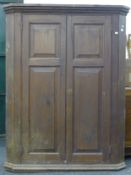 A Victorian pine corner cupboard. 153 cm high.