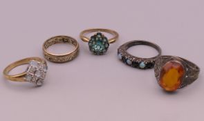 Three 9 ct gold rings (7.5 grammes total weight) and two silver rings.