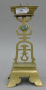 A Chinese brass pricket candlestick. 28 cm high.