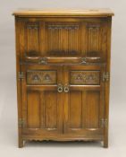 An Old Charm cocktail cabinet. 76 cm wide.