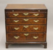 An 18th century and later walnut caddy top chest of drawers, with brushing slide. 75.5 cm wide.