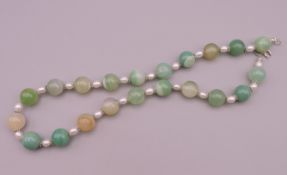 A pearl and jade necklace. Approximately 44 cm long.