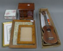 A ukulele, two jewellery boxes and a quantity of prints.