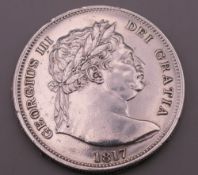 An 1817 silver half crown coin.