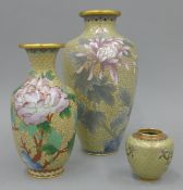 Three pale ground cloisonne vases. The largest 26 cm high.