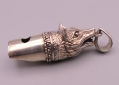 A 925 silver fox head form whistle. 3.5 cm long.