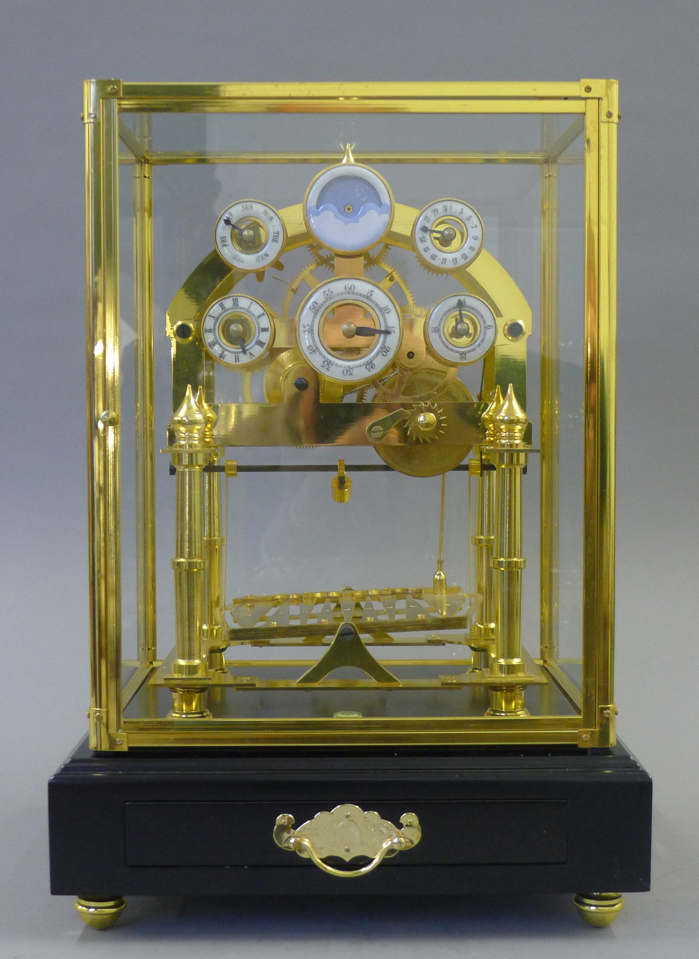 A moon phase congreave clock. 43 cm high.
