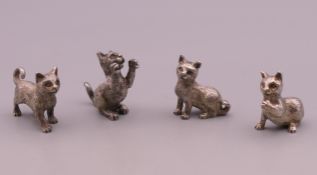 Four silver models of cats, hallmarked London 1990. Standing cat 3 cm long.