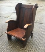 An oak lambing chair. 70 cm wide.