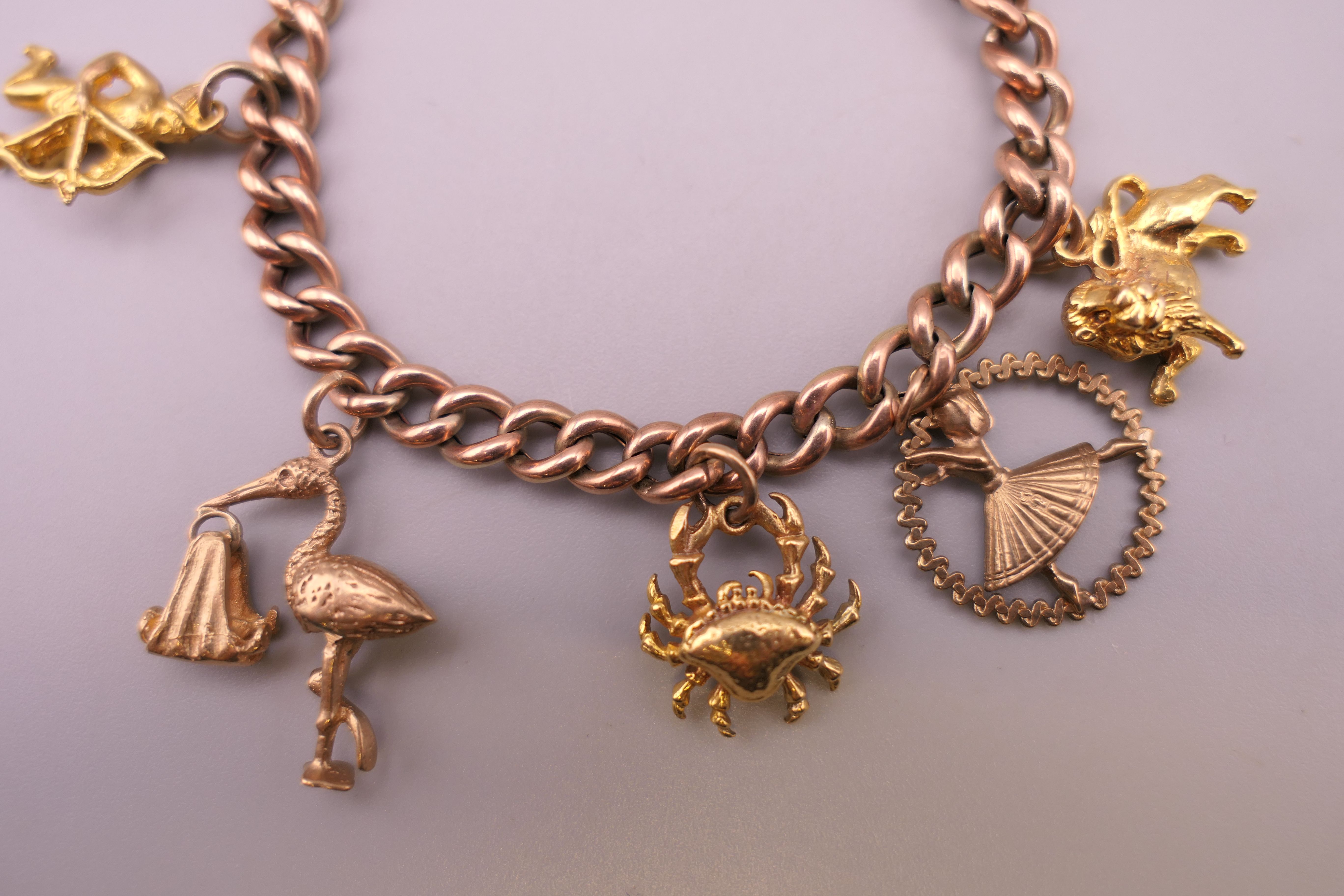 A 9 ct gold charm bracelet. Approximately 14 cm long. 18.4 grammes. - Image 2 of 4